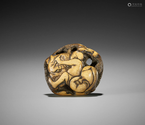 A STAG ANTLER RYUSA NETSUKE OF A MASK CARVER