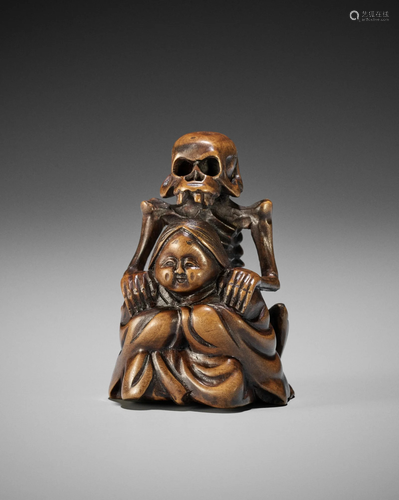 A WOOD NETSUKE OF A SKELETON MASSAGING OKAME