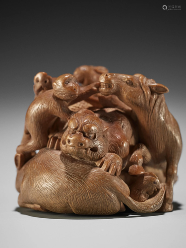 A FINE WOOD NETSUKE OF THE JUNISHI