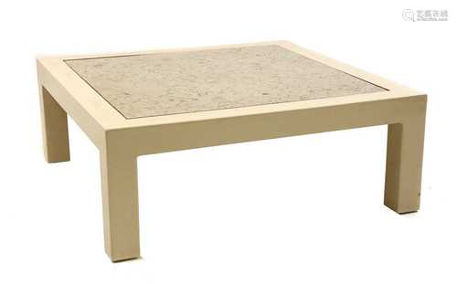 A cream lacquered low coffee table,