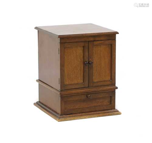 An oak tabletop smoker's cabinet,