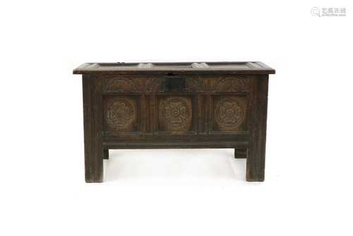 A 17th century small oak panelled coffer,