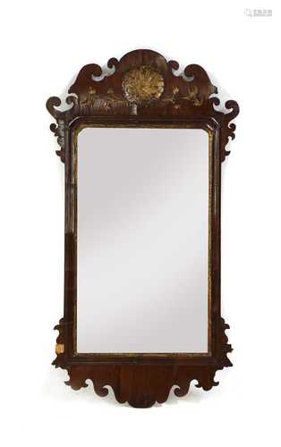 A George II walnut and parcel-gilt mirror,