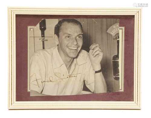 An autographed photograph by Frank Sinatra at the studio of ...