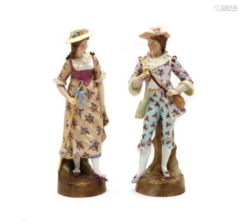 A pair of continental porcelain figurines,