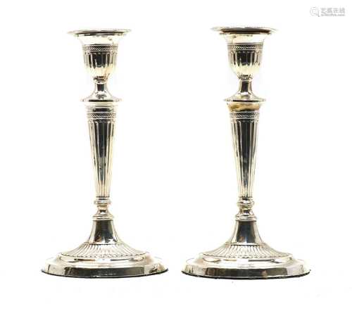 A pair of Adam revival silver candlesticks,