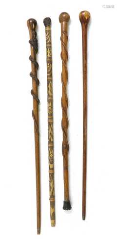 A folk art carved walking stick,