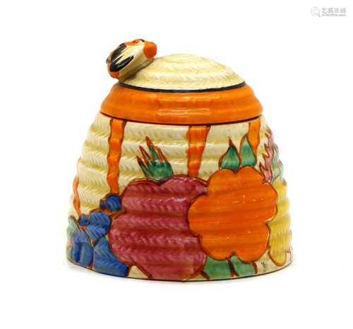 A Clarice Cliff honey pot,