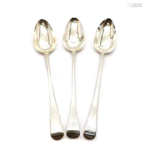 A group of three silver basting spoons,