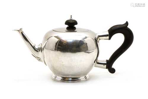 A silver teapot in the George II style