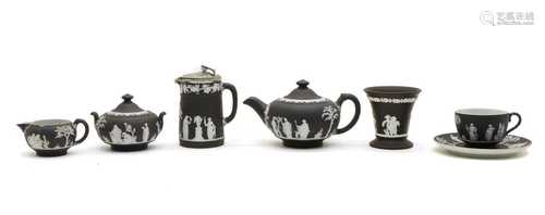 A collection of black Wedgwood jasperware items,