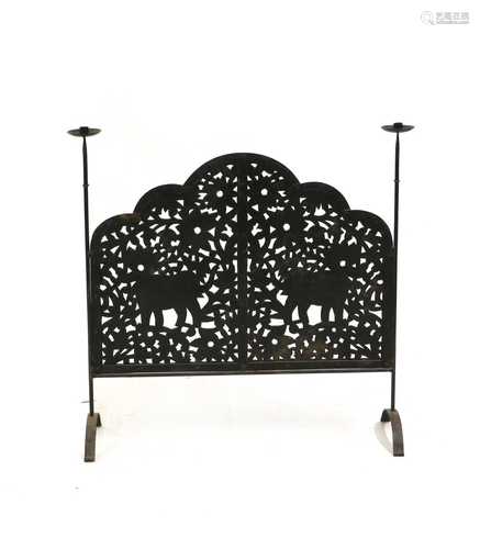 A wrought-iron firescreen,