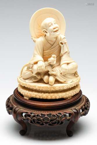 An Antique Carved Ivory Figure of a Chinese Immortal On Stan...