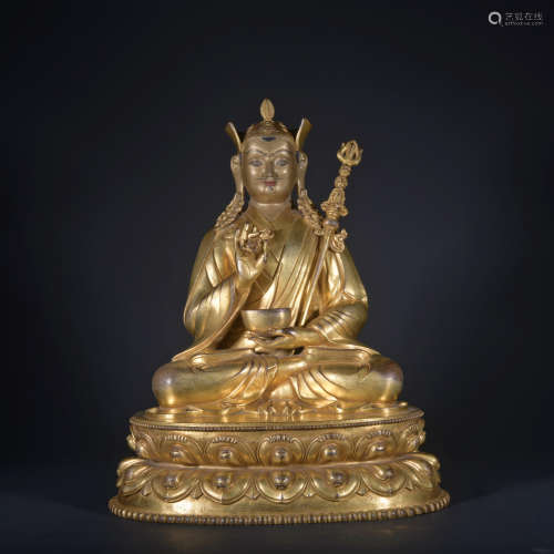 A gilt-bronze statue of Guru