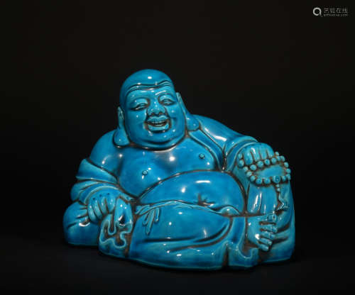 A peacock blue glazed Maitreya Buddha