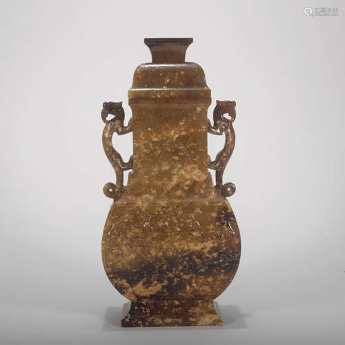 A jade vase and cover