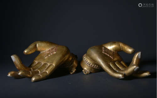 A pair of gilt-bronze buddha hand