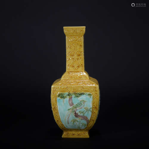 A yellow glazed vase