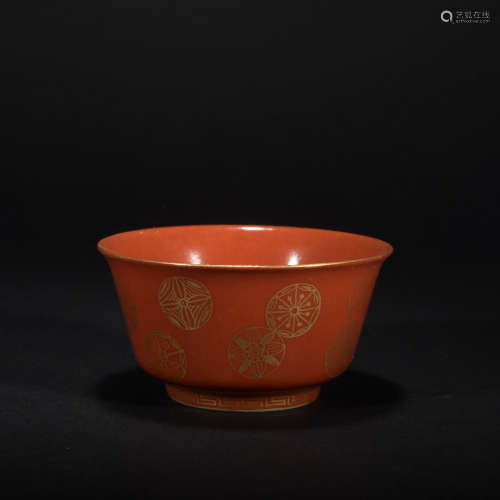 A coral red glazed cup