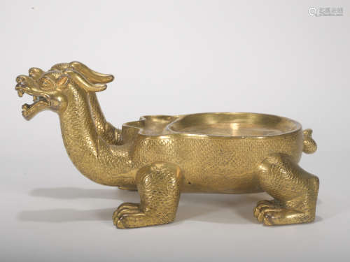 A gilt-bronze 'beast' washer