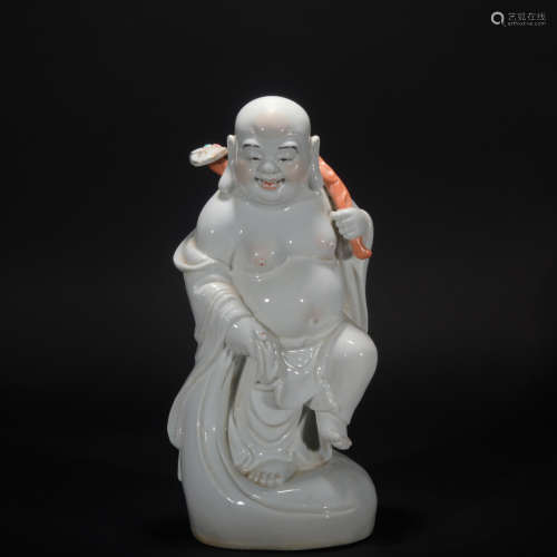 A white glazed buddha