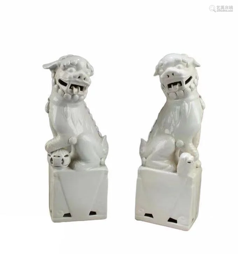 A Pair of Blanc De Chine Foo Lion Statues