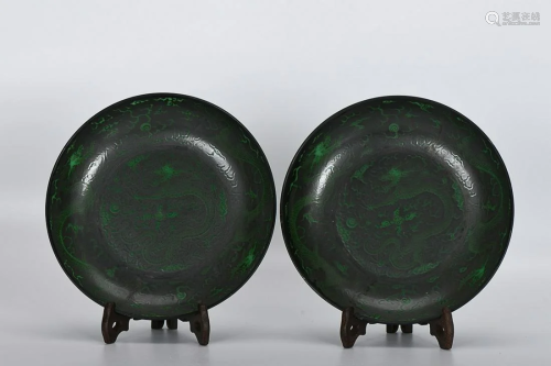 PAIR OF BLACK- GLAZED 'DRAGON' CHARGERS