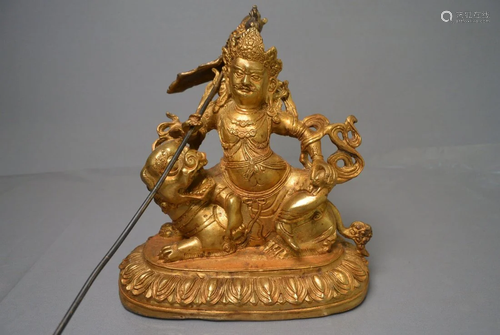 Gilt bronze statue of the god of wealth riding a lion