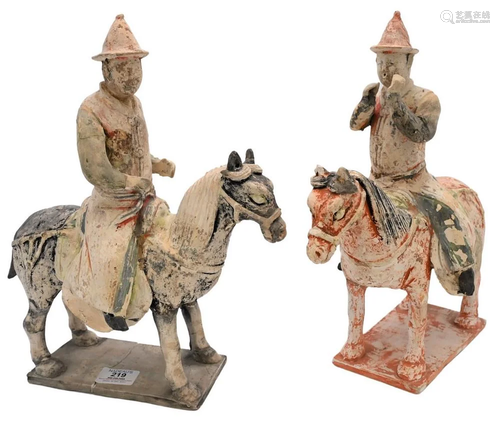 Pair of Painted Pottery, to include figures on horses,