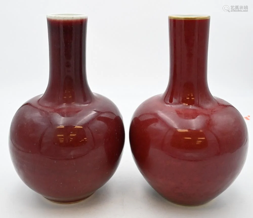 Pair of Chinese Bottle Form Oxblood Langyao Vases, one