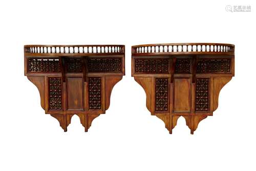 A PAIR OF ORIENTALIST MASHRABIYA-STYLE HARDWOOD WALL SHELVES...