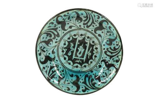 A PSEUDO-KUBACHI BLACK AND TURQUOISE EARTHENWARE DISH Possib...