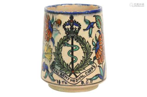 A PALESTINIAN IZNIK-STYLE POTTERY MUG WITH THE BRITISH ROYAL...