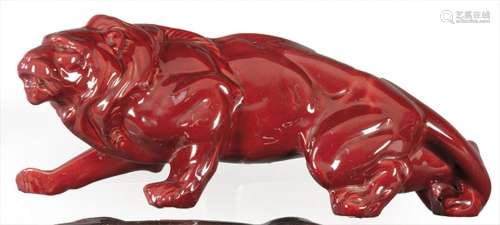 Lion in red glazed ceramic, Art Deco style. size: 18 x 46 cm...
