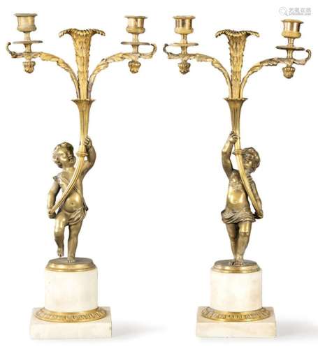 Pair of bronze and marble candlesticks with child-shaped ste...