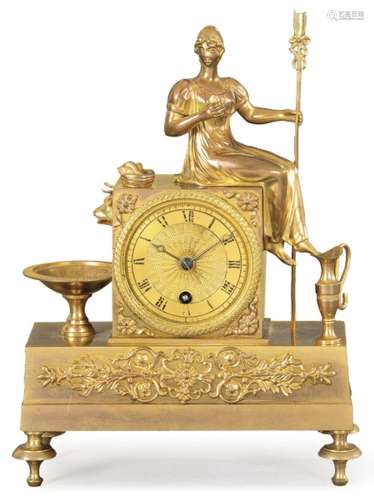 Empire period Table clock in gilt bronze. On a rectangular p...
