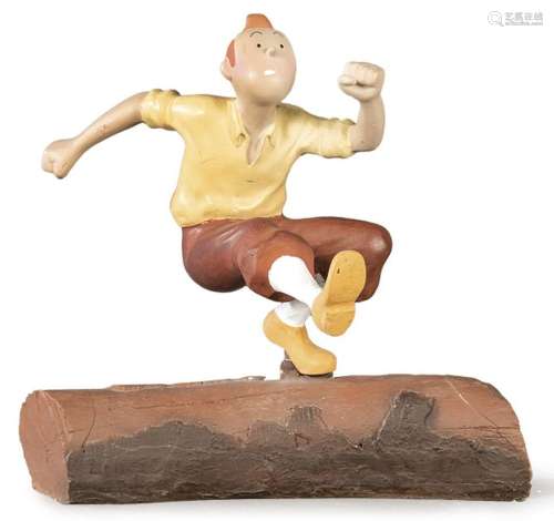Tintin Jumping a Log in painted resin. size: 29 x 28 cms.