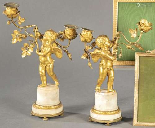 Pair of gilded bronze and white marble candlesticks, S. XIX....