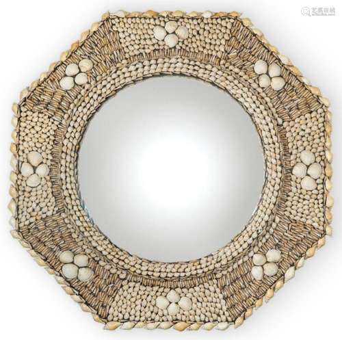 Octagonal mirror frame made of different types of shells. Wi...