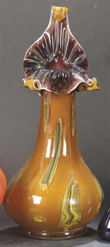 Blown Murano vase with flower-shaped mouth. In amber color w...
