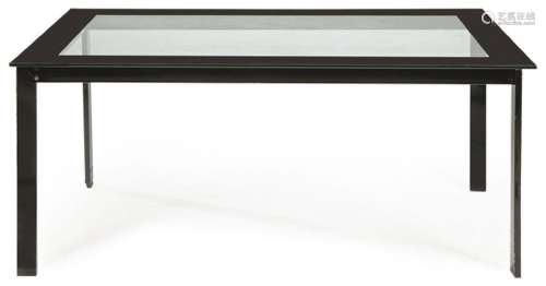 Dining table with black lacquered metal frame and transparen...