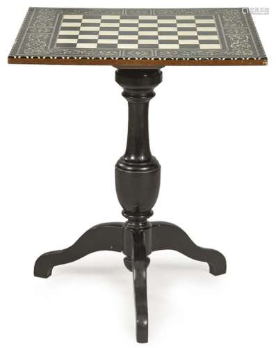 Table with top with chess board with candelieri decoration i...