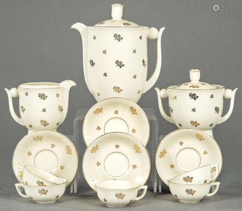 Glazed porcelain coffee set from Limoges with gold flower de...