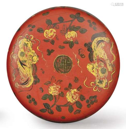 Chinese circular wooden box painted in red and with black an...