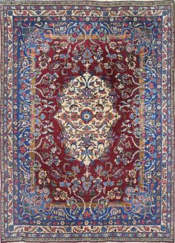 Persian wool rug, Tabriz type, h. 1970. Red field with clear...