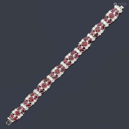 Bracelet with oval cut rubies and a knob of approx…