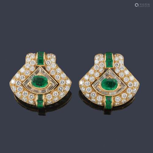 Short earrings with a pair of oval-cut emeralds of…