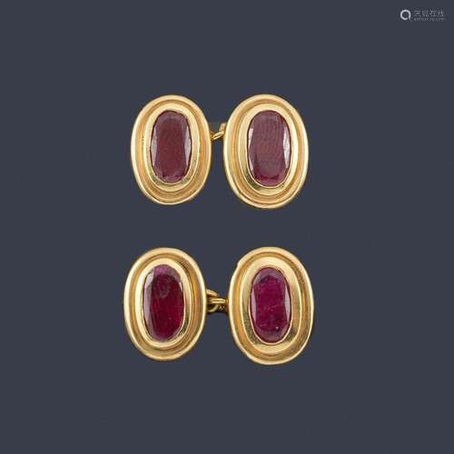 Oval cufflinks with oval-cut rubies set in a bezel…