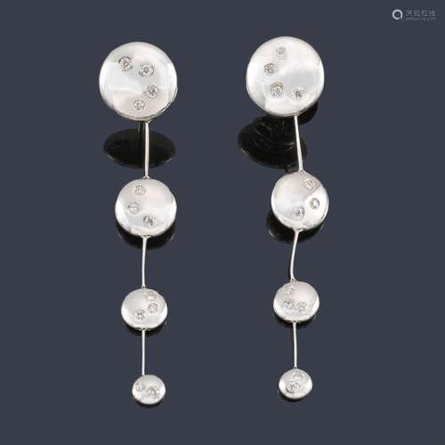 Long earrings with diminishing circular motifs spr…