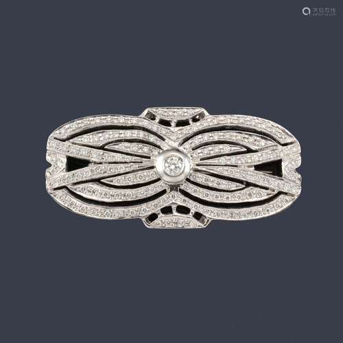 Openwork brooch with curved bands of diamonds of a…